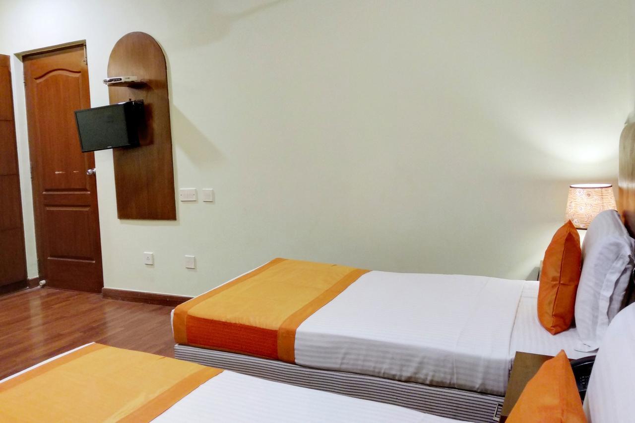 Oyo 6110 Thalassa Suites Bangalore Bagian luar foto